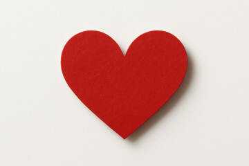 Fototapeta premium Red paper heart cutout on white background for valentine's day concept 