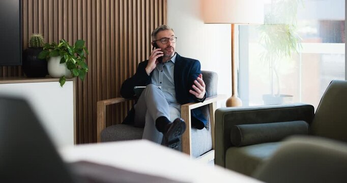 Businessman, smile or talking in office with phone call for finance advice, budget report and review. Mature person, conversation and tech in workplace for contact, financial management and planning.