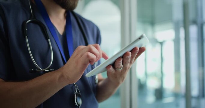 Hands, nurse and typing with tablet in hospital for patient information, appointment and schedule. Clinic, database and healthcare person with technology for telehealth, medical service or research