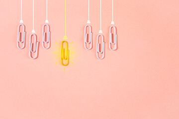 Ideas concept with paperclip as a light bulb