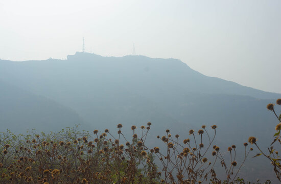 India, Maharashtra, Pune, The Iconic Panoramic View of Sinhagad Fort in Foggy Winter Days, The 17th Century Chhatrapati Shivaji Maharaj Fort.
