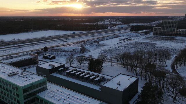Aerial drone video of a datacenter at High Tech Campus Veldhoven during winter sunset, highlighting computing power, colocation services, data storage, and modern digital infrastructure.