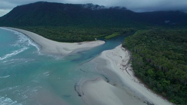 aerial shot above noah beach and noah creek near cape tribulation in the daintreee rainforest north of Cairns, Queensland, Australia