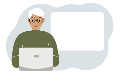 A old man works or on a laptop, there is a place for text nearby. The concept of freelancing or distance learning and work.