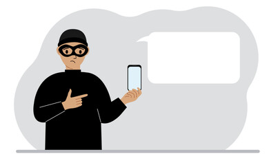Hacker in a black mask with a mobile phone. The cybercriminal is holding a smartphone. Cyber attack, mobile phishing, scam.
