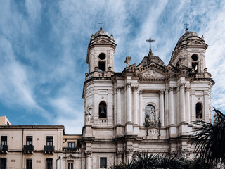 Obraz premium Church Of San Camillo Ai Crociferi In Catania, Sicily: Historic Baroque Church Facade With Twin Bell Towers And Stone Architecture Under Cloudy Sky