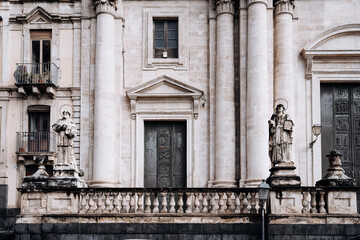 Church Of San Camillo Ai Crociferi In Catania, Sicily: Historic Baroque Church Facade With Twin Bell Towers And Stone Architecture Under Cloudy Sky