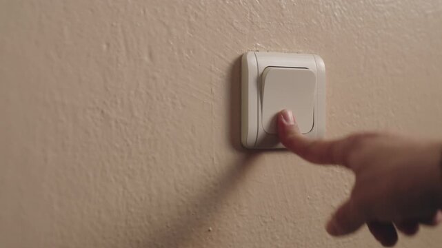 A close-up view of a light switch on a textured wall, fa01