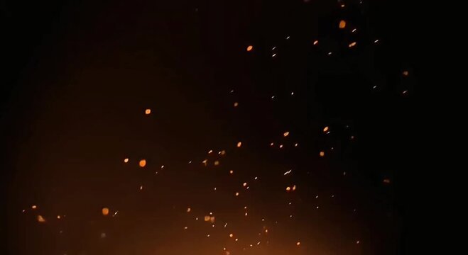 Dark cinematic video background with small glowing fire sparks gently floating in the air. Warm orange and amber particles create a soft, elegant and atmospheric motion on a dark backdrop.
