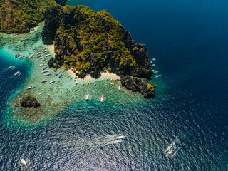 aerial view of El Nido, Philippines, featuring emerald lagoons, limestone karst islands, and vibrant tropical waters © Marcel Poncu