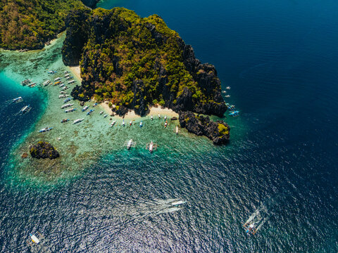 aerial view of El Nido, Philippines, featuring emerald lagoons, limestone karst islands, and vibrant tropical waters