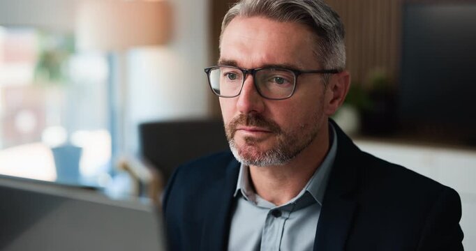 Mature man, laptop and glasses at office for proposal review, insight or project at insurance company. Person, broker or advisor with computer, feedback and perspective at risk management agency