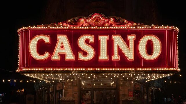 Bright vintage red casino sign with glowing marquee lights at night, classic entrance to gambling venue scene