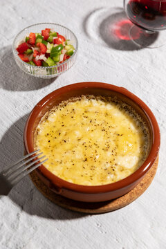 Grilled Provolone cheese with oregano, argentinian provoleta.