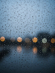 City Lights Through a Wet Window, Urban Landscape, Atmospheric Mood