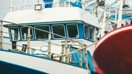 Docked Fishing Boats with Colorful Hulls