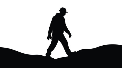 Silhouette of a man walking on a hill with a hat