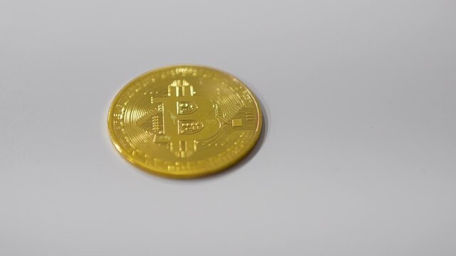 Money, money, lots of money. Bitcoin on a white background.