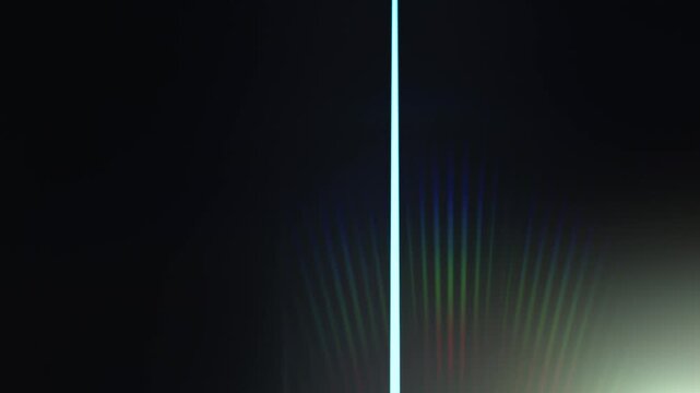 Lens Flare, abstract bokeh lights moving. Leaking Reflection of a Glass, Crystal, Defocused Shining Colorful rainbow Light Leaks, Rays on Black Background 