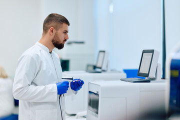 Laboratory technician examines data at high-tech lab during research session