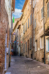 The historic streets of Urbino, a medieval town in Marche, Italy, with charming stone buildings and steep, winding staircases. Urbino, Marche, Italy