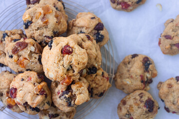 freshly baked fruitcake cookies on cooling rack.