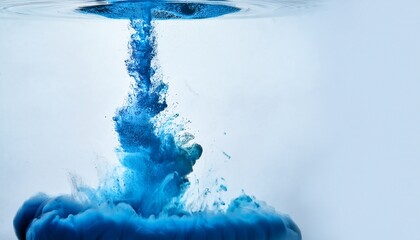 vibrant blue powder falling into water and dissolving with splashes dynamic liquid action copy space