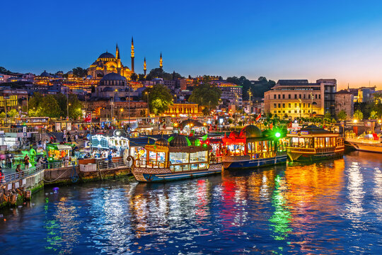 Istanbul, Turkey - July 12, 2025: View of the cruise ships and Suleymaniye Mosque on the Golden Horn inlet.