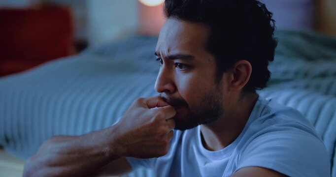 Night, thinking and man in bedroom, biting nails and sleep disorder with insomnia, ptsd and fear. Evening, home or person with depression, stress or anxiety with mental health, scared and regret