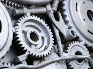 Silver gears and other car parts, repurposed and beautifully displayed.