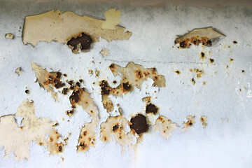 The iron background is old, dirty, and heavily rusted.