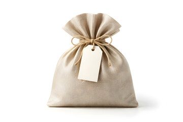 Elegant beige fabric gift pouch with blank white tag tied with natural twine, isolated on a white background. Concept of luxury present or favor.