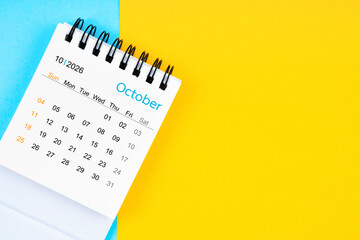 October 2026, Monthly desk calendar for 2026 year on yellow and blue background.