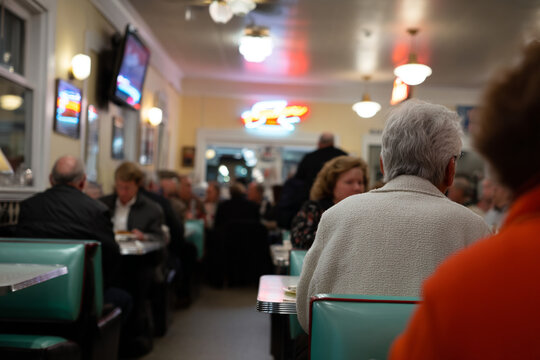 Old-fashioned diner interior with retro neon.