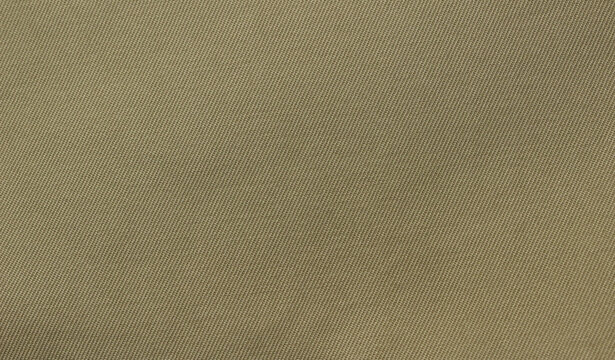 Beige fabric texture. Beige fabric used for trench coat background. Close-up of beige cloth.
