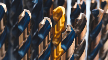 various types of drill bits milling cutter. display is organized and bits are arranged in way that makes it easy to see the differences between them © Aleksandr Matveev