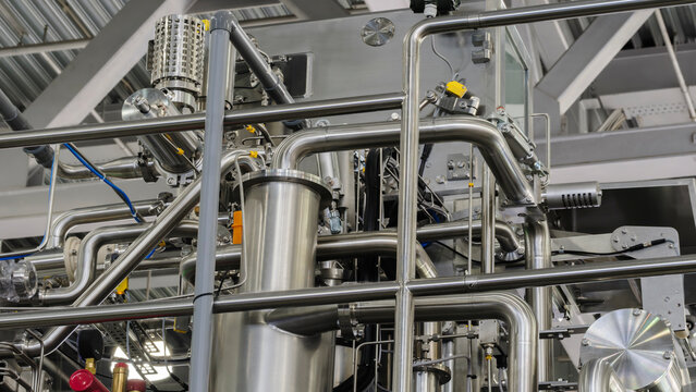 Food production machine with stainless steel pipes, cooling radiator as separator and tanks, valves and measuring instruments