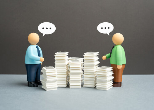 Two office workers are having difficulty communicating due to formalities and bureaucracy. Excessive rules, slow processes and barriers to collaboration harming teamwork and decision making