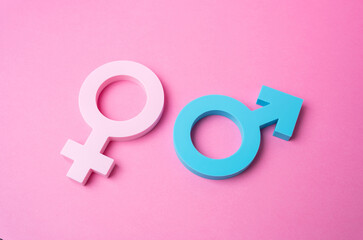 Male and female gender symbols on a pink background. Heterosexual relationships. Valentine's Day....