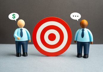 Discussion of business goals. Strategic alignment meeting, shared vision and planning dialogue. Team communication shaping priorities, performance targets and coordinated actions