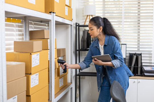 Small business warehouse inventory management, woman owner scanning barcode in storage, checking stock accuracy with digital tablet technology, controlling logistics workflow, worker working in store