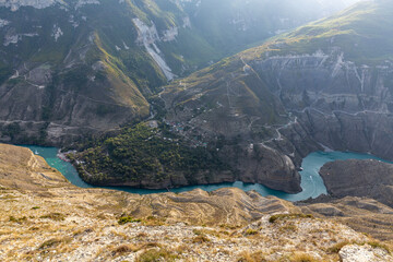 Landscape of bright turquoise river in the North Caucasus mountains