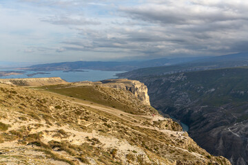 Beautiful scenery with highland turquoise lake and mountain canyon