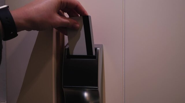 Guest opening a hotel room door with an electronic key card. Security and protection system concept. High quality 4k footage