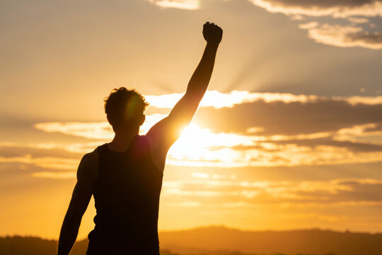 Strong man with fist up into the sky. Competition, determination and finding strength concept.  
