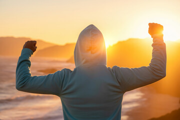 Back view of strong motivated woman celebrating workout goals towards the sun. Morning healthy training success. 
