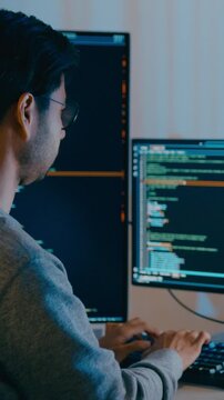 Vertical Screen : Group Adult Asia male freelance typing write prompt AI bot IT app smart program nomad, video game, terminal with coding language, big data center on desktop computer in night office.