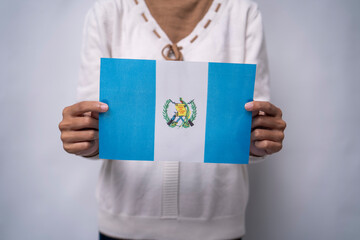 Hands Holding Flag of the Nation Guatemala