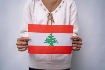 Hands Holding Flag of the Nation Lebanon