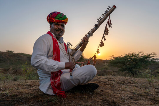 Rajasthani folklore musician playing  Ravanahatha instrument in Pushkar Rajasthan India